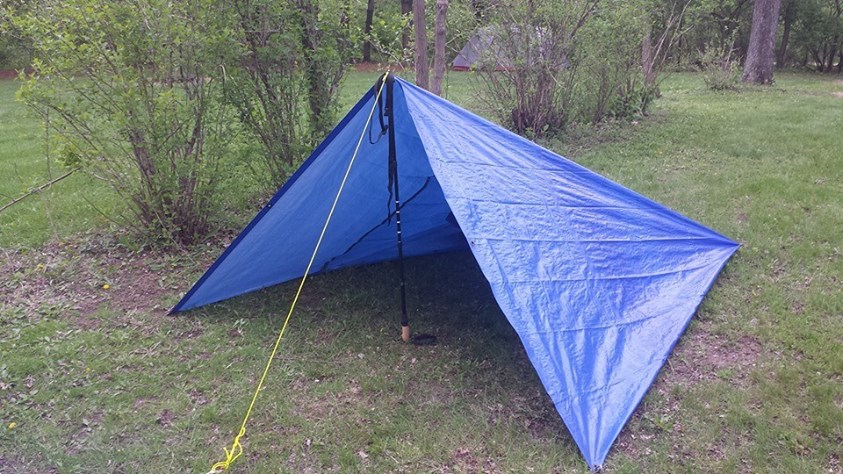8 Alternative Uses for Hiking Sticks | PTT Outdoor Makeshift tent pole with a hiking stick